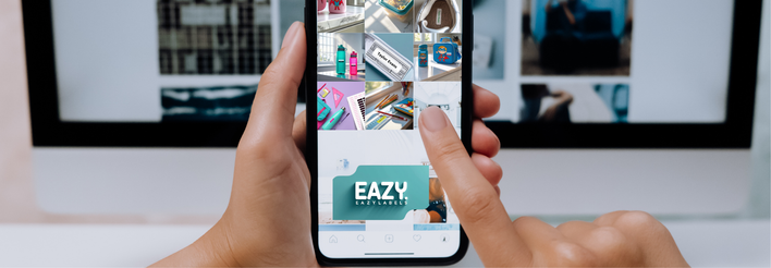 Person holding a smartphone displaying the Eazy app with a blurred office background